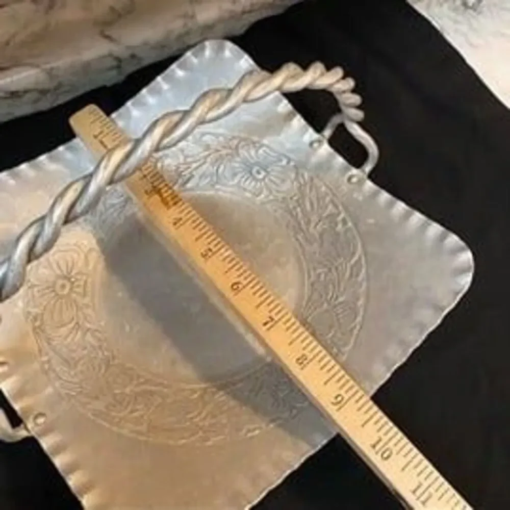 * hand-forged hammered aluminum basket engraved floral bouquet twisted handle